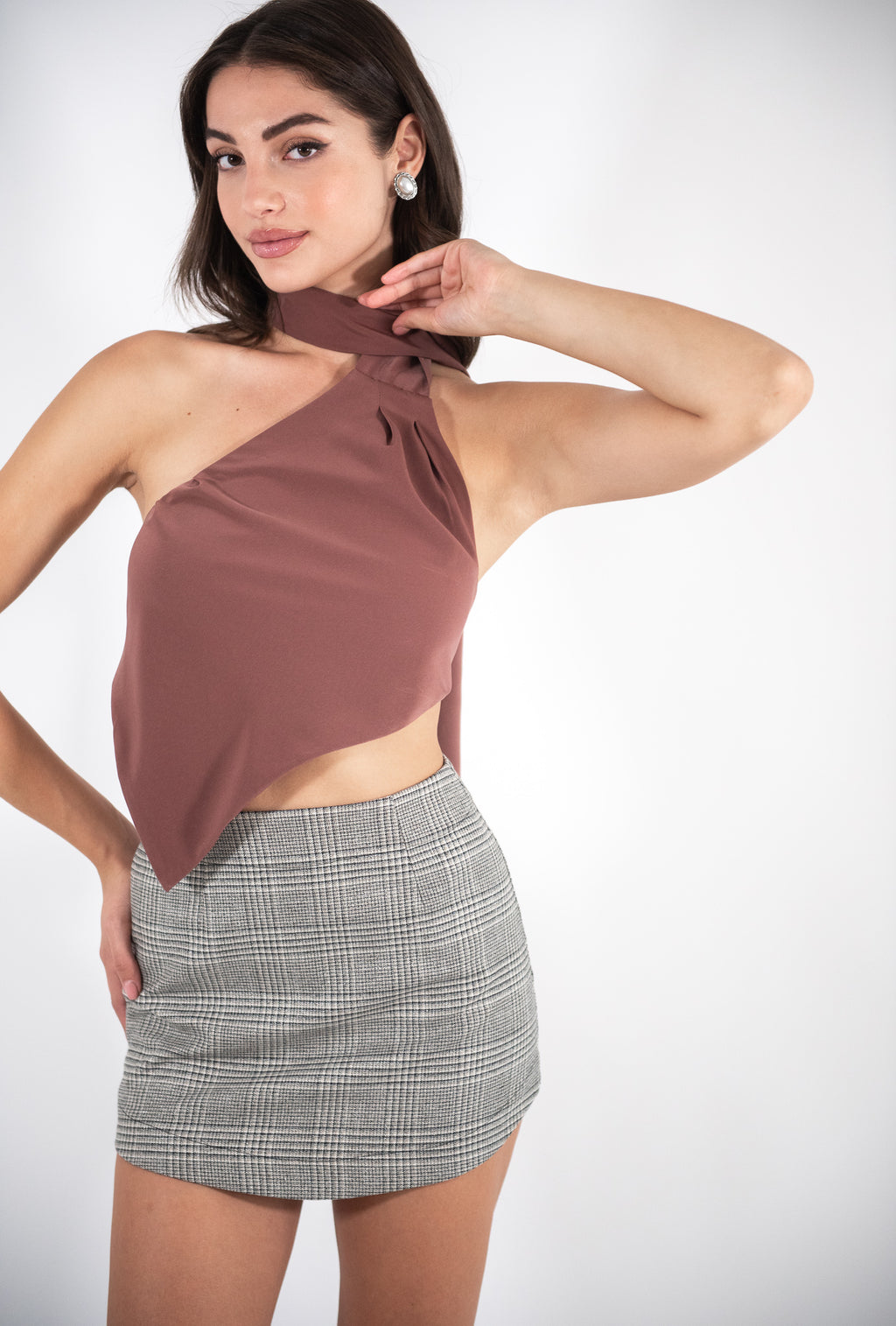 Woman wearing brown top, front view.