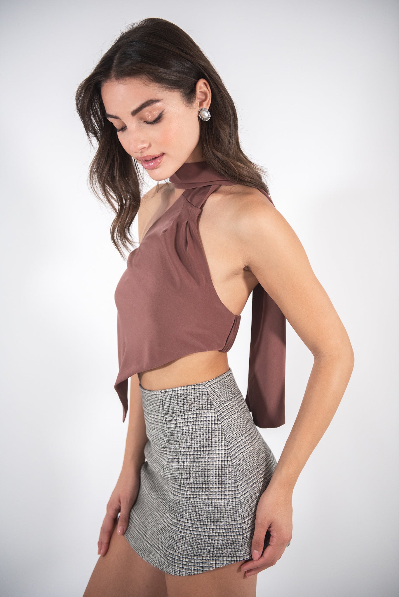 Wearing checkered skirt