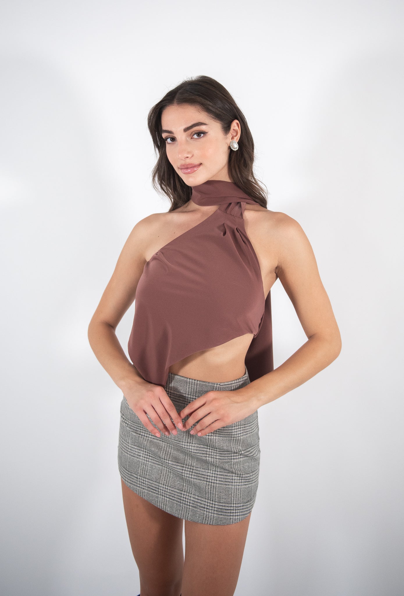 Woman wearing brown top, front view.