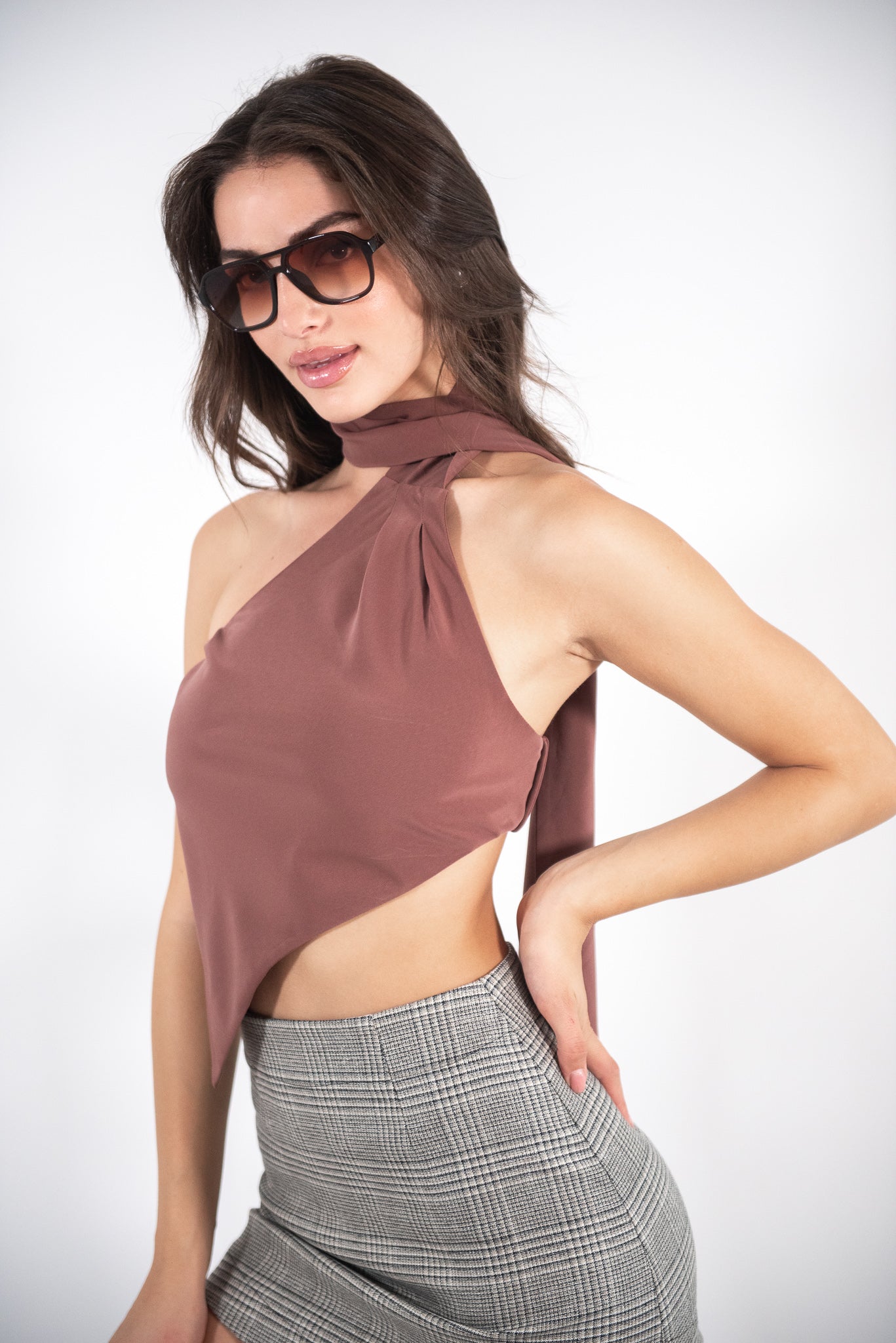 Woman wearing a brown top, front view