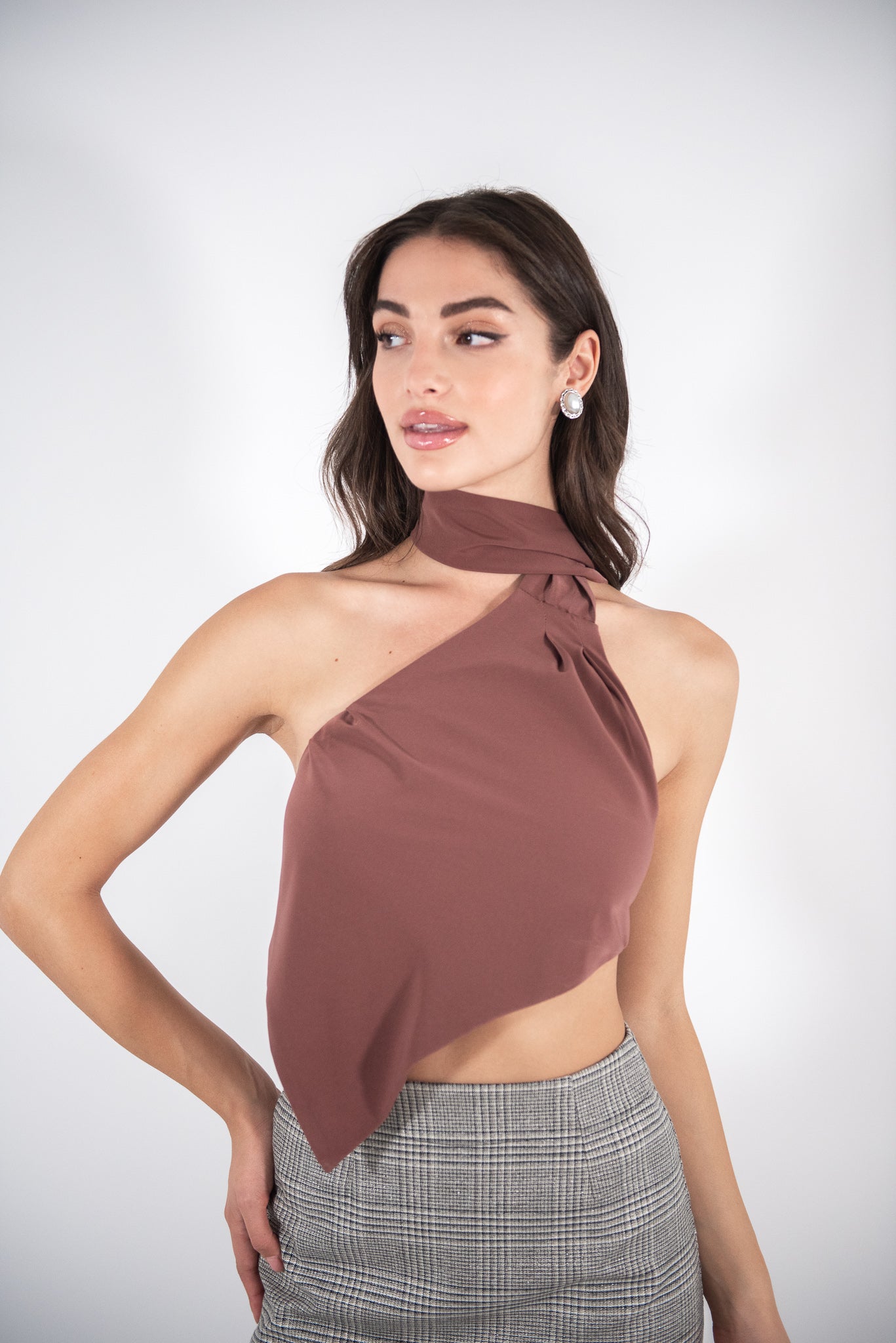 Woman wearing a brown top, front view